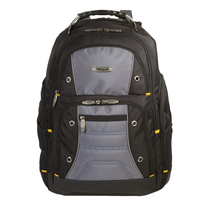 Targus Drifter backpack, front view on a white background. The bag is black nylon with gray accent panels and orange zipper pulls. Features visible include a rugged carry handle at the top, dual industrial zipper pulls on the main compartment, a metal Targus logo badge on the upper front panel, metal grommets along the front, a zippered front workstation pocket with gray paneling, and mesh side pockets. The water-resistant molded base is black.