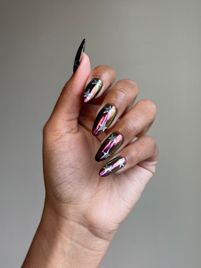 Silver stars on multichrome nails