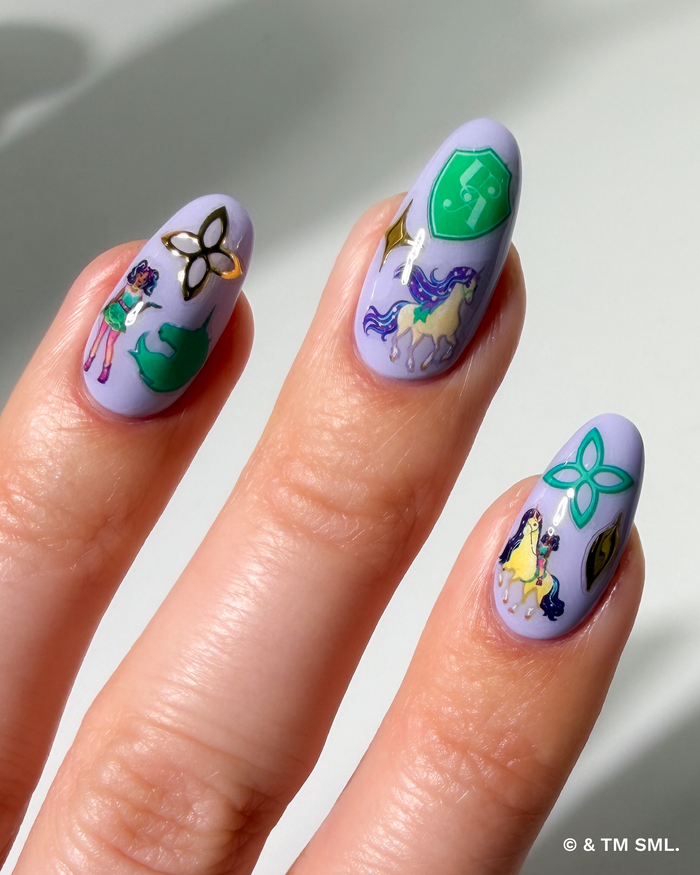 Hand with cartoon stickers on purple nails on a neutral background
