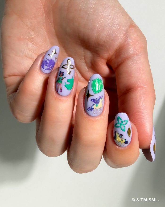 Hand with cartoon stickers on purple nails on a neutral background