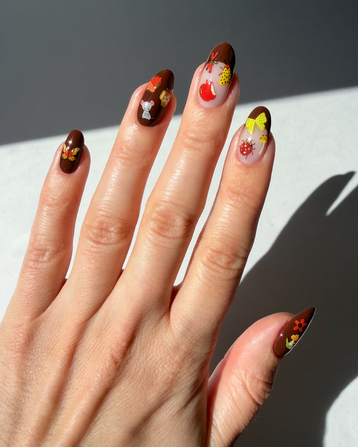 Cinnamon Stick stickers on a brown base and brown french tips
