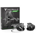 A product image of Decibullz Custom Moldable Surveillance Radio Headset Earpieces with Awareness. The black, custom moldable earpieces are positioned in the foreground, with the packaging box visible in the background. The box features the Decibullz logo and emphasizes "Awareness + Comfort.