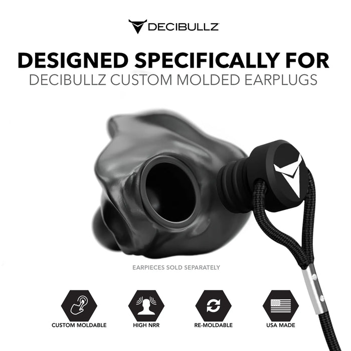 A promotional image for Decibullz Custom Molded Earplug Lanyard showcasing a black Decibullz moldable earpiece with a premium earplug lanyard. Icons at the bottom highlight features: "Custom Moldable," "High NRR," "Re-Moldable," "USA Made." Text at the top reads, "Designed Specifically for Decibullz Custom Molded Earplug Lanyard.