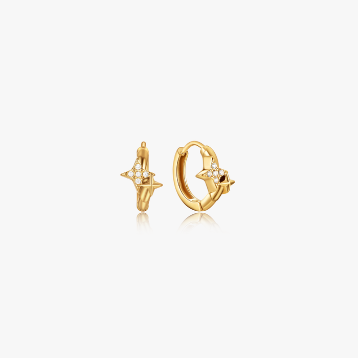 Estelle Double Star Mini Hoops: Small gold hoops with four-pointed star charms, encrusted with tiny stones, made of stainless steel and 18K PVD gold plated. Sold as pairs.