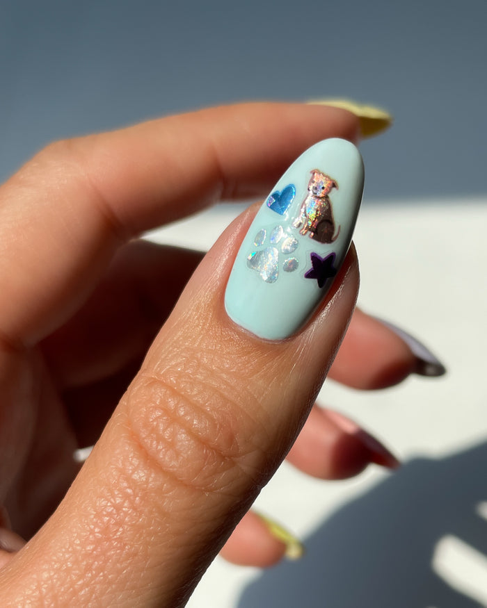 Holo Puppy and Paw Sticker on blue nail