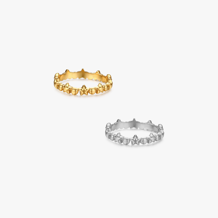 Kate Star Ring featuring two stackable bands with rounded star motifs; one in polished yellow-gold, the other in silver-tone, both tarnish-resistant and safe for sensitive skin.