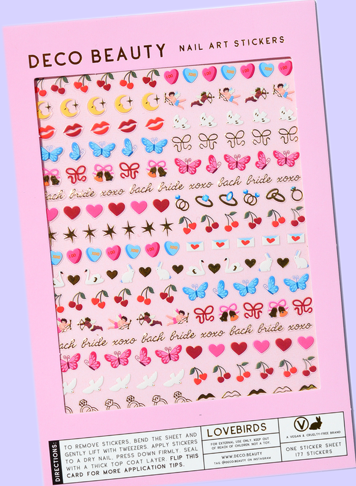 Lovebirds sheet flat lay slanted on purple background