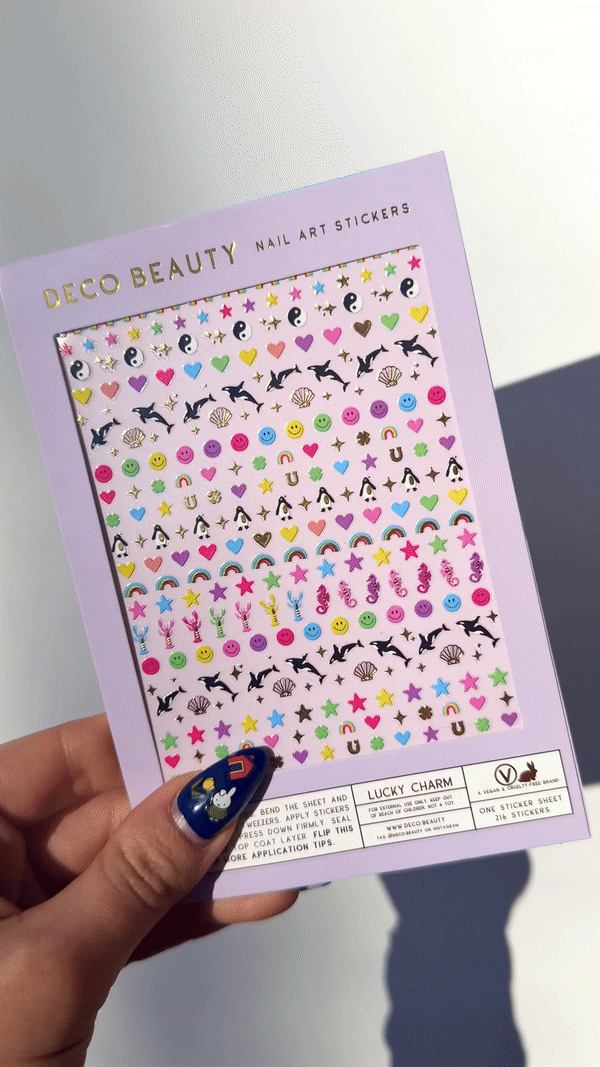 GIF of Lucky Charm stickers, featuring orcas and lucky shapes in rainbow colors