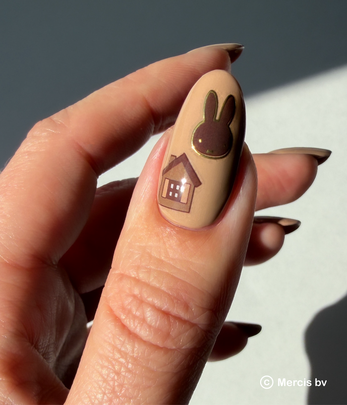 Nail art with a Miffy and house design on a neutral background