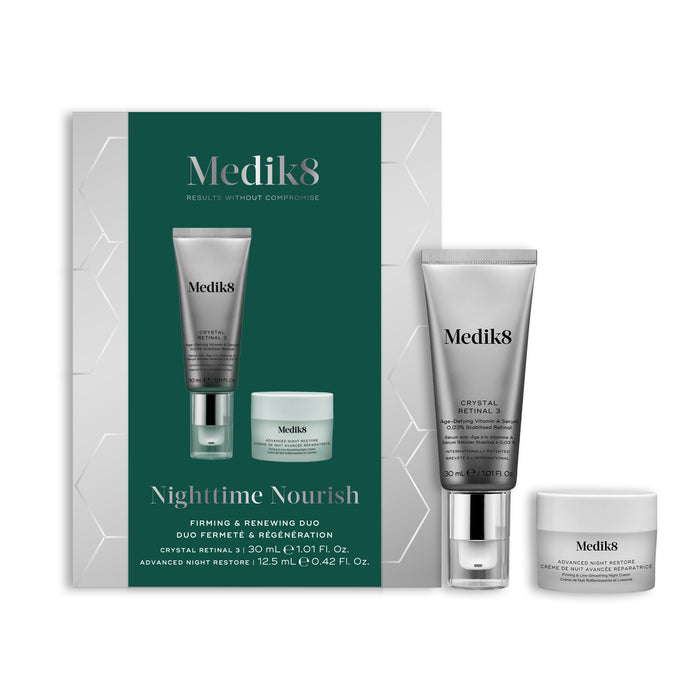 A Medik8 "Nighttime Nourish" gift box displayed on a white background with a dark green center and hexagonal graphics, showing the printed products inside. A Crystal Retinal 3 tube and an Advanced Night Restore travel size jar stand loose beside the box.