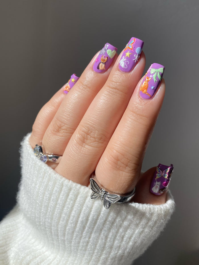 Pet Shop Nail Stickers on purple nails