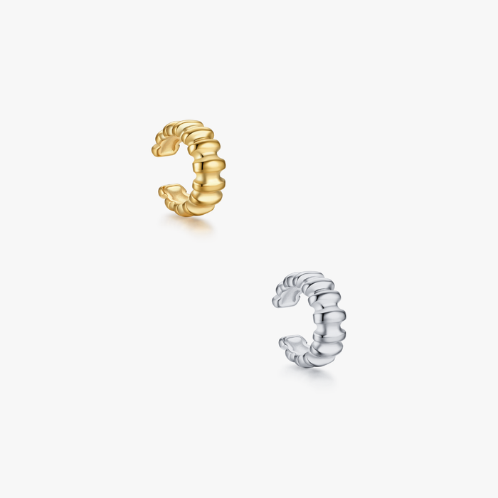 Ribbed Ear Cuff: Two textured, open-ended hoop ear cuffs in gold and silver finishes, featuring a rippled, segmented design for non-pierced ears.