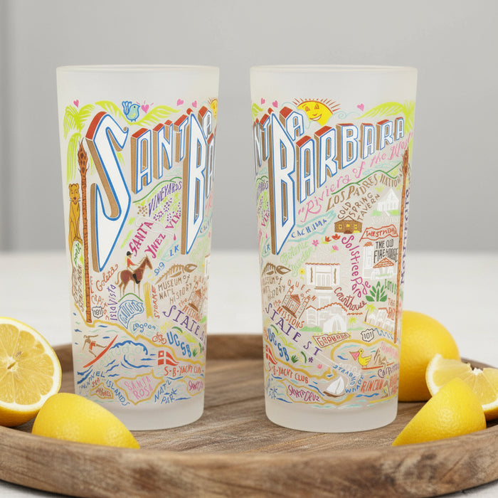 Two colorful tumblers with illustrations and text on a white background