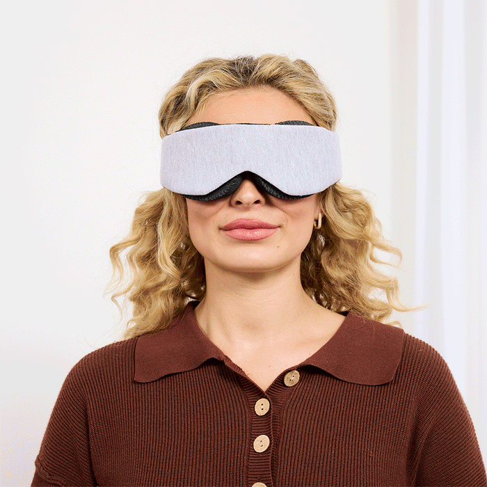Female shows how to wear sleep mask