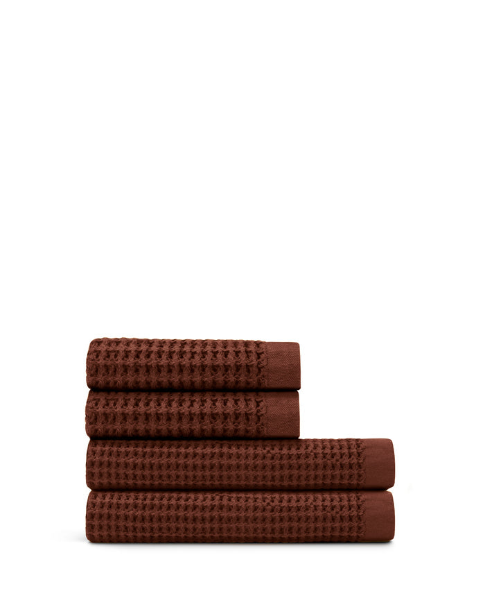 Supima® Waffle 4pc Bath Sheet Bundle featuring soft brown towels stacked neatly.