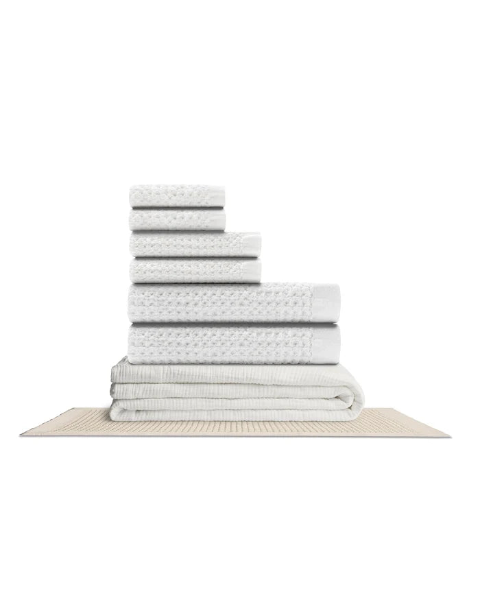 Supima waffle complete bathroom bundle featuring stacked towels and a bath mat for a coordinated bathroom decor.