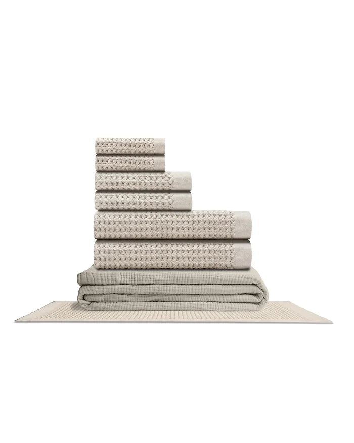 Supima waffle complete bathroom bundle featuring coordinated bath towels and bath mat arranged elegantly.