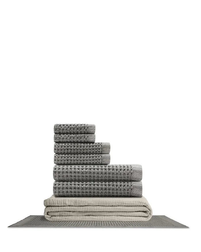 Supima waffle complete bathroom bundle featuring stacked towels and bath mat in coordinating gray colors.